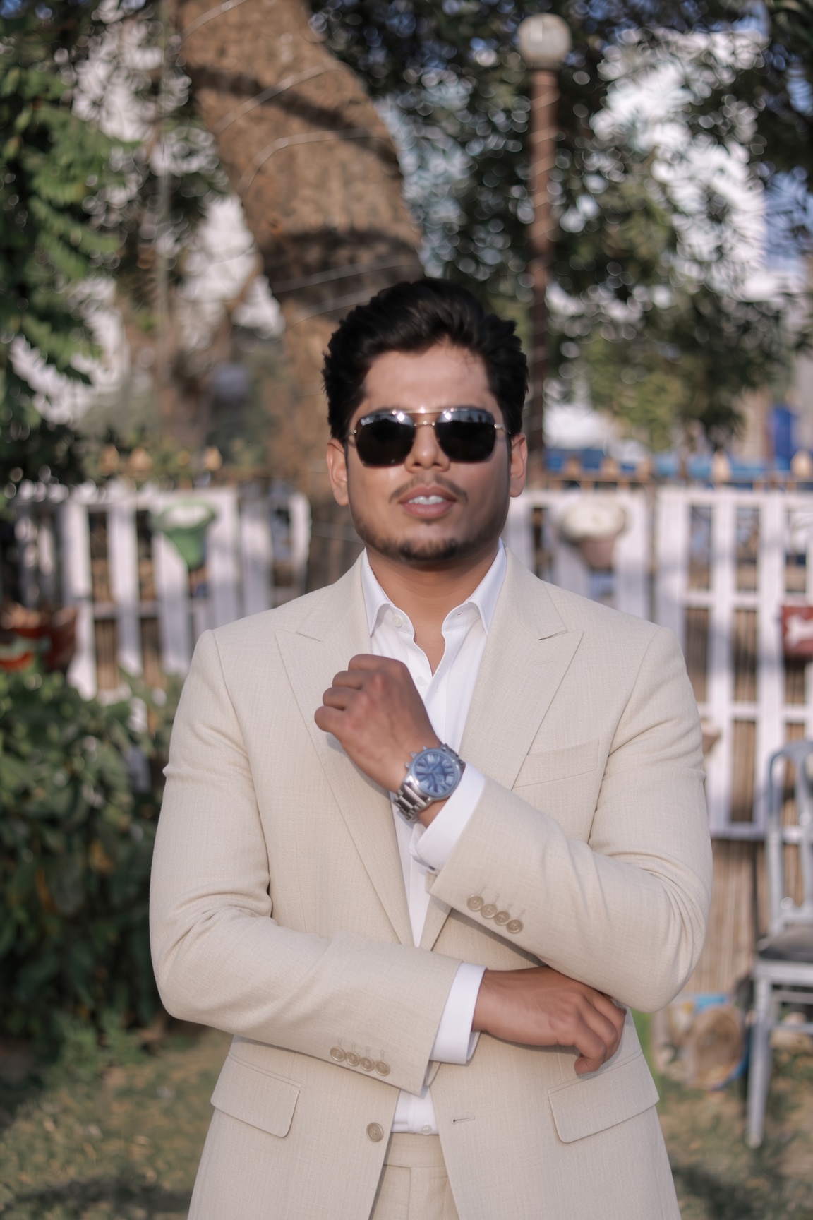 Muhammad Laraib Khan, Co-Founder and CEO of Rebootix AI, in a cream suit